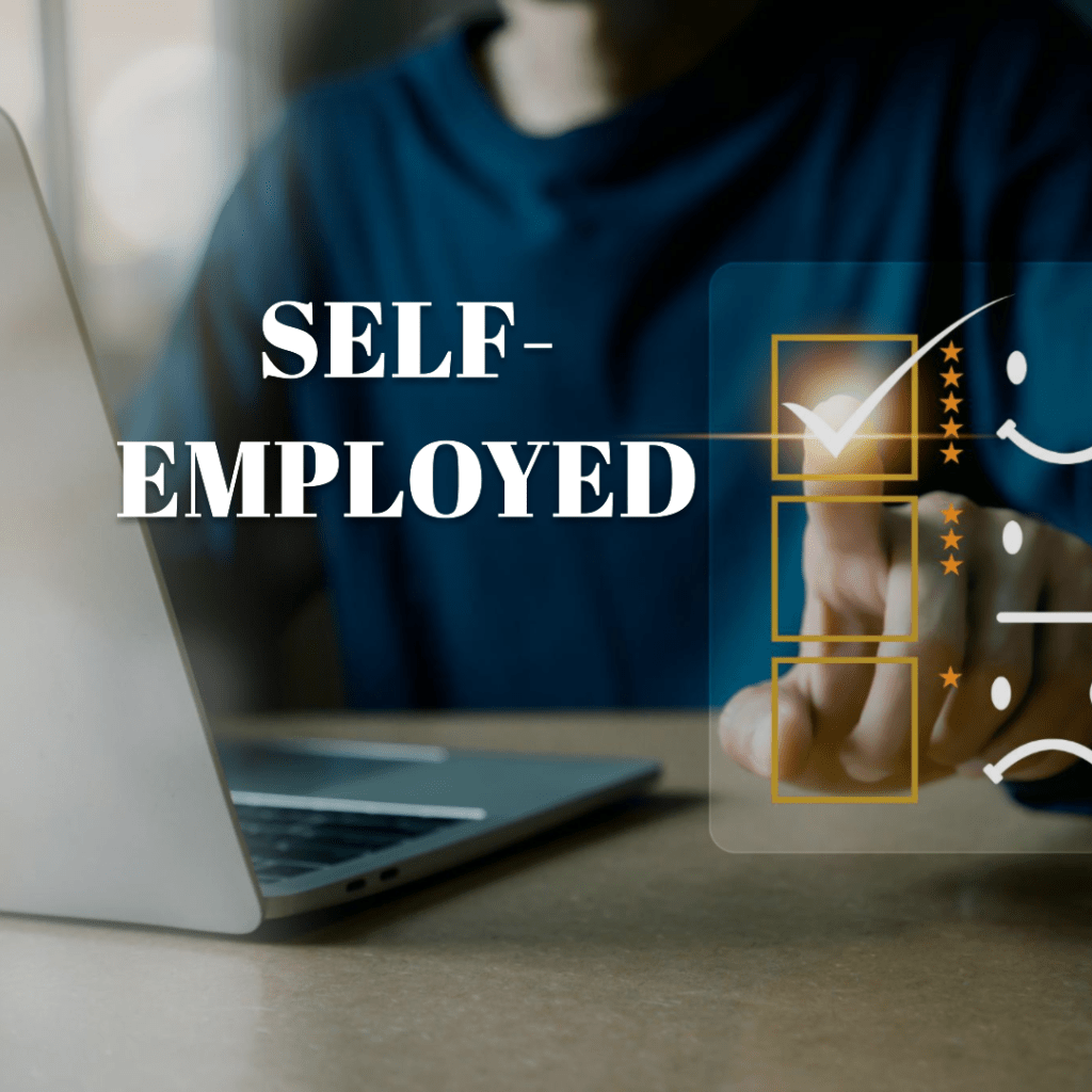 a man sitting at a computer who is self employed