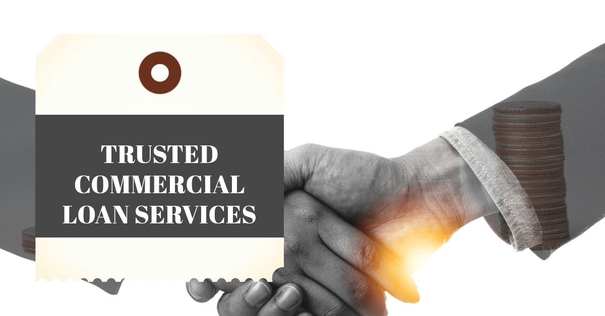 2 People shaking hand on a deal over a commercial loan agreement with the following text "Trusted Commercial Loan Services"